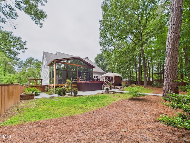7501 Montibillo Pkwy, Durham, NC 27713 - fenced backyard featuring a gazebo, a hot tub, and a deck