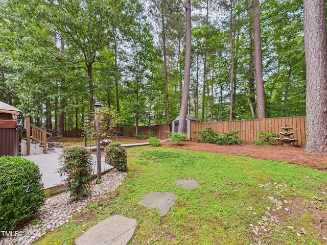7501 Montibillo Pkwy, Durham, NC 27713 - fenced backyard with a storage unit, a patio, and view of scattered trees