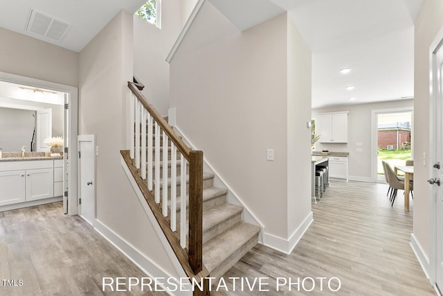 7678 New Sandy Hill Church Rd, Sims, NC 27880 - stairway with wood finished floors