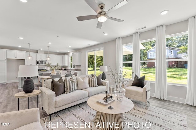 7678 New Sandy Hill Church Rd, Sims, NC 27880 - living room featuring healthy amount of natural light, light wood-style flooring, recessed lighting, and ceiling fan