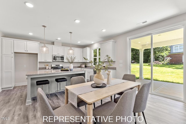 7678 New Sandy Hill Church Rd, Sims, NC 27880 - dining space with light wood-style floors and recessed lighting