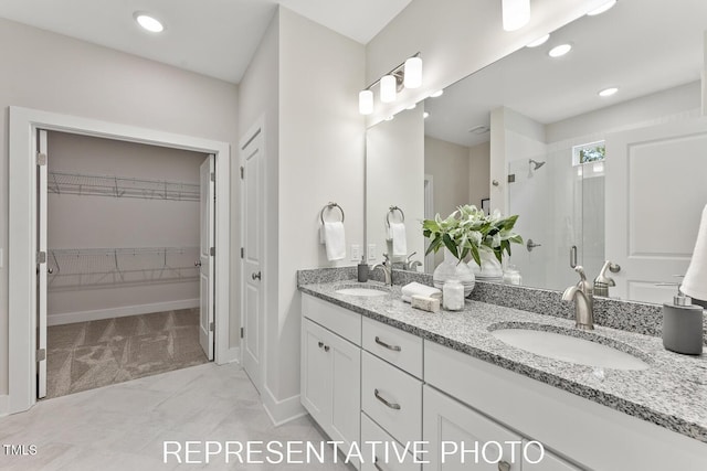 7678 New Sandy Hill Church Rd, Sims, NC 27880 - bathroom with a shower stall, double vanity, a walk in closet, recessed lighting, and marble finish flooring