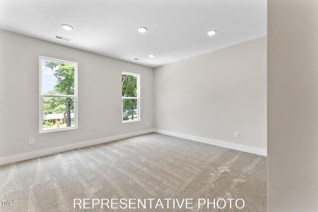 7678 New Sandy Hill Church Rd, Sims, NC 27880 - carpeted spare room featuring baseboards and recessed lighting