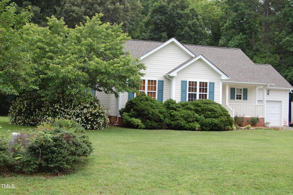 3145 Pier Pointe Dr, Creedmoor, NC 27522 - view of front of home featuring a shingled roof, a garage, and a front yard