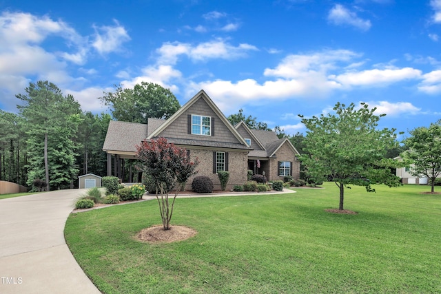 3728 Marwick Ct, Wendell, NC 27591 - craftsman-style home with an outdoor structure, a front yard, concrete driveway, and a garage
