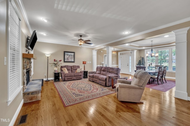 3728 Marwick Ct, Wendell, NC 27591 - living area featuring ornate columns, ornamental molding, wood finished floors, a fireplace, and a ceiling fan