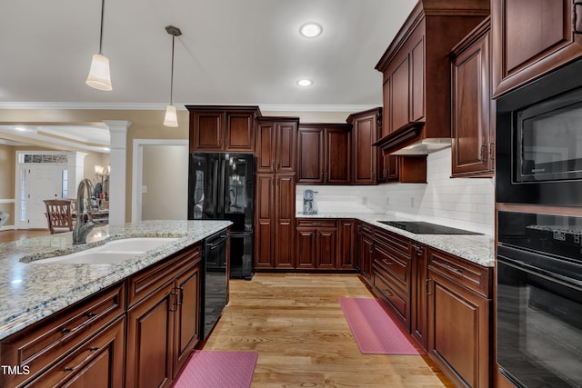 3728 Marwick Ct, Wendell, NC 27591 - kitchen featuring black appliances, decorative columns, ornamental molding, decorative backsplash, and pendant lighting