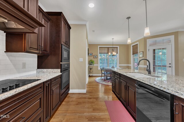 3728 Marwick Ct, Wendell, NC 27591 - kitchen featuring black appliances, extractor fan, light wood-type flooring, a chandelier, and backsplash