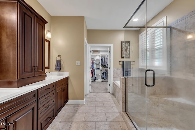 3728 Marwick Ct, Wendell, NC 27591 - bathroom with double vanity, a shower stall, and a spacious closet