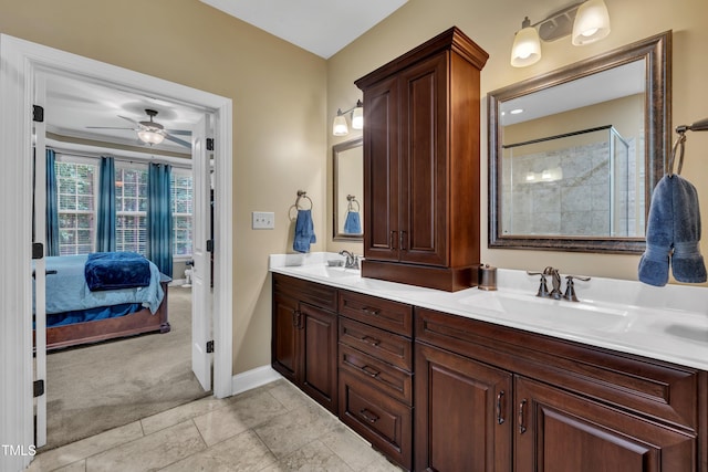 3728 Marwick Ct, Wendell, NC 27591 - ensuite bathroom with double vanity, a ceiling fan, and a tile shower