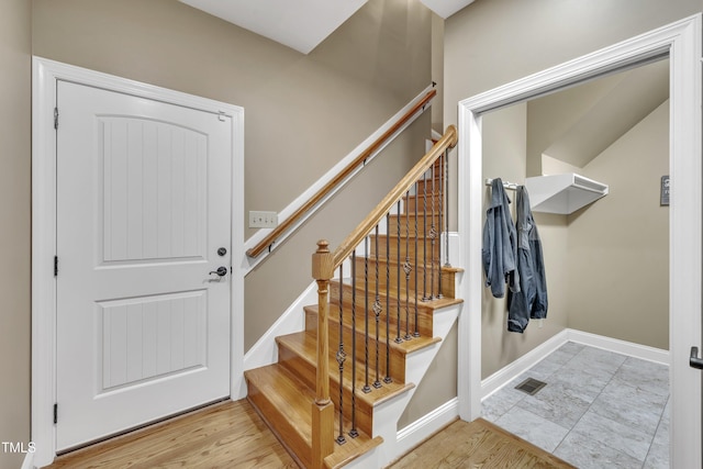 3728 Marwick Ct, Wendell, NC 27591 - stairway featuring baseboards and wood finished floors