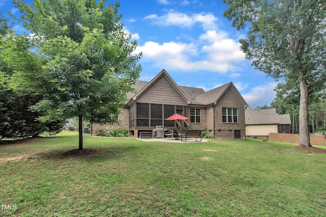 3728 Marwick Ct, Wendell, NC 27591 - back of house featuring a sunroom, a patio area, and brick siding