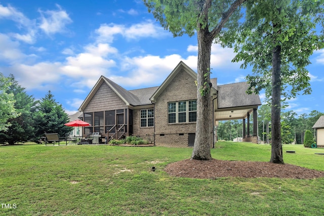 3728 Marwick Ct, Wendell, NC 27591 - rear view of property featuring a sunroom, crawl space, a yard, brick siding, and a shingled roof