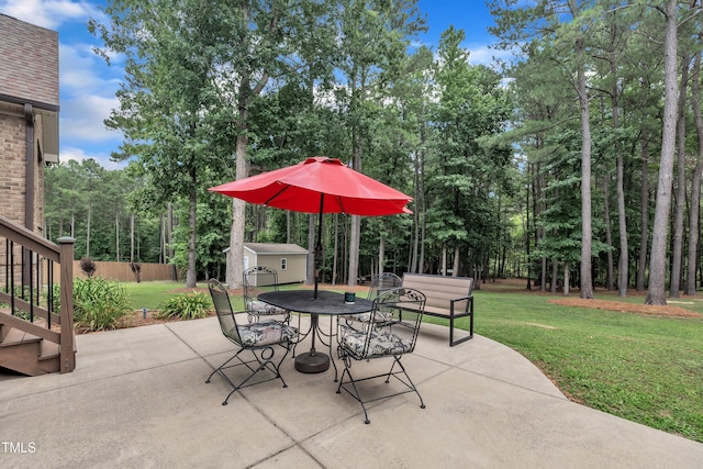3728 Marwick Ct, Wendell, NC 27591 - view of patio / terrace featuring a shed, outdoor dining space, and view of wooded area