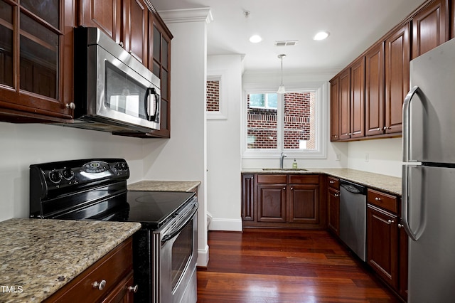 400 W Rosemary St Unit 114, Chapel Hill, NC 27516 - kitchen with stainless steel appliances, dark wood-type flooring, light stone countertops, decorative light fixtures, and recessed lighting