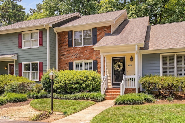 1563 Laureldale Dr, Raleigh, NC 27609 - view of front facade featuring roof with shingles