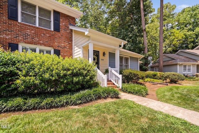 1563 Laureldale Dr, Raleigh, NC 27609 - view of front of house featuring a front yard and brick siding