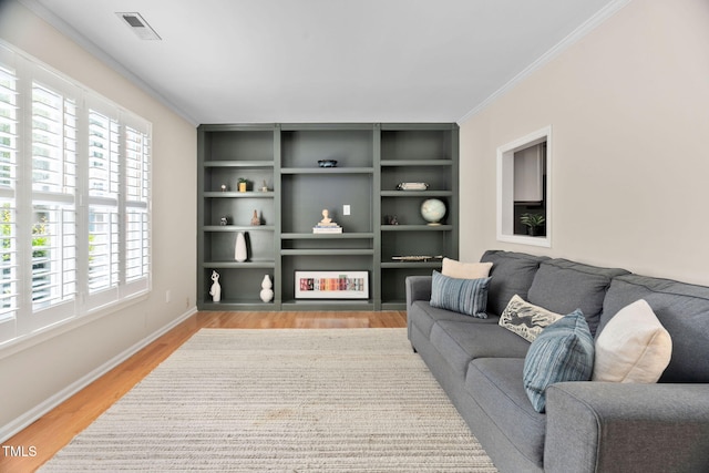 1563 Laureldale Dr, Raleigh, NC 27609 - living area featuring light wood finished floors and ornamental molding