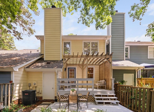 1563 Laureldale Dr, Raleigh, NC 27609 - back of house featuring a chimney and a wooden deck