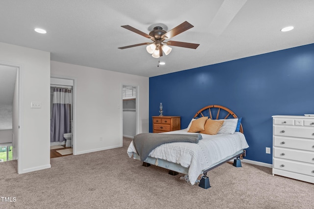 11 Stone Village Ct, Durham, NC 27704 - bedroom featuring carpet flooring, recessed lighting, a ceiling fan, a walk in closet, and ensuite bath