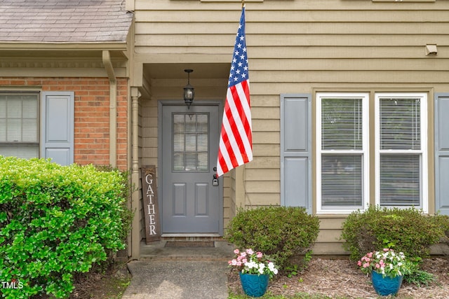 11 Stone Village Ct, Durham, NC 27704 - doorway to property featuring brick siding