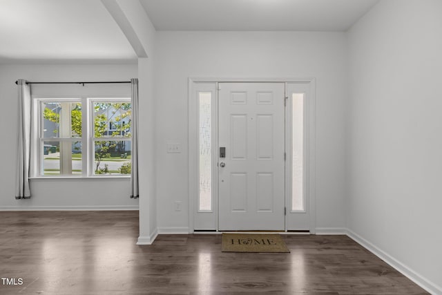 1414 Arena Ln, Fuquay Varina, NC 27526 - foyer entrance featuring arched walkways and wood finished floors