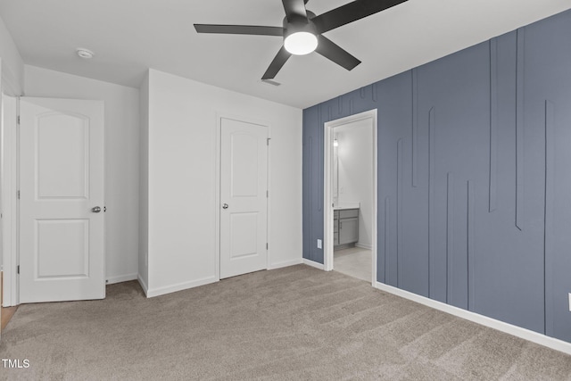 1414 Arena Ln, Fuquay Varina, NC 27526 - unfurnished bedroom featuring carpet floors, ensuite bath, and ceiling fan