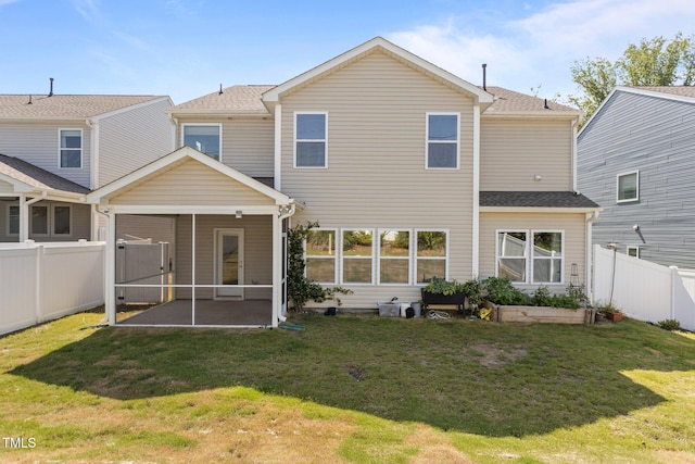 1414 Arena Ln, Fuquay Varina, NC 27526 - back of house featuring a sunroom, a fenced backyard, and a shingled roof