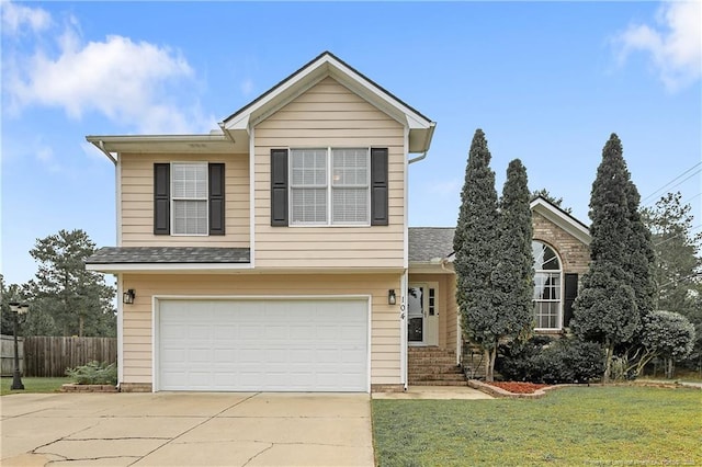 104 Somerset Dr, Raeford, NC 28376 - view of front of property featuring a garage and concrete driveway