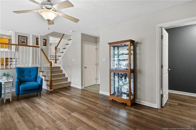104 Somerset Dr, Raeford, NC 28376 - living area featuring stairway, wood finished floors, ceiling fan, and a textured ceiling