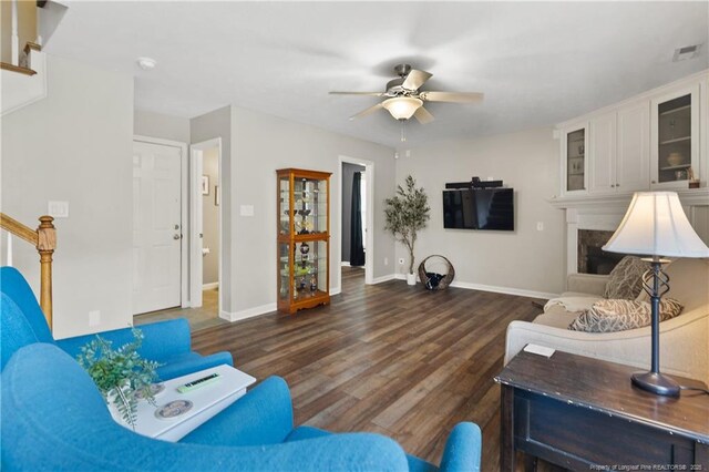 104 Somerset Dr, Raeford, NC 28376 - living room with a ceiling fan, wood finished floors, stairs, and a premium fireplace