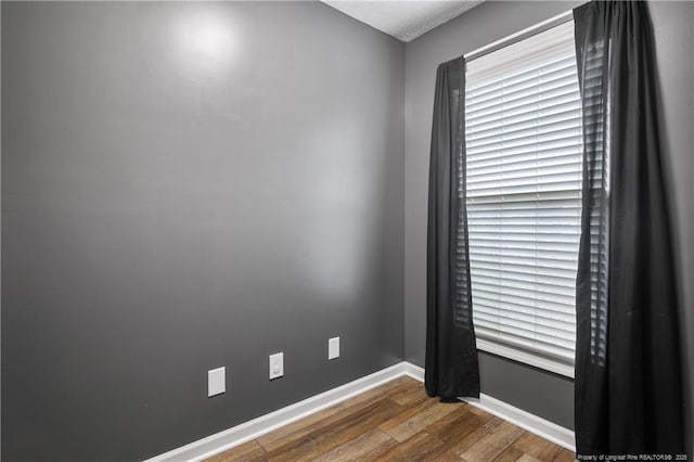 104 Somerset Dr, Raeford, NC 28376 - spare room featuring wood finished floors and baseboards