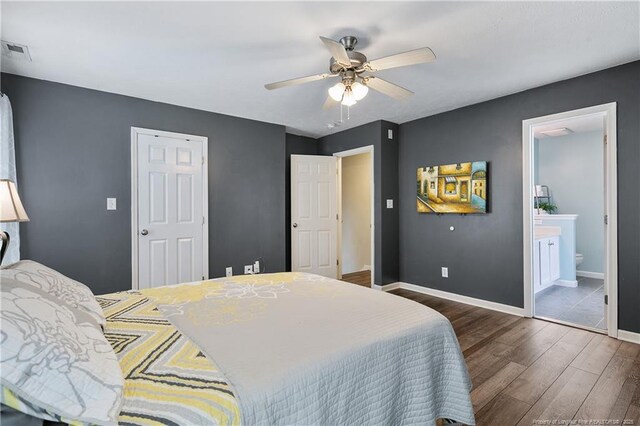 104 Somerset Dr, Raeford, NC 28376 - bedroom with dark wood finished floors, ensuite bath, and ceiling fan