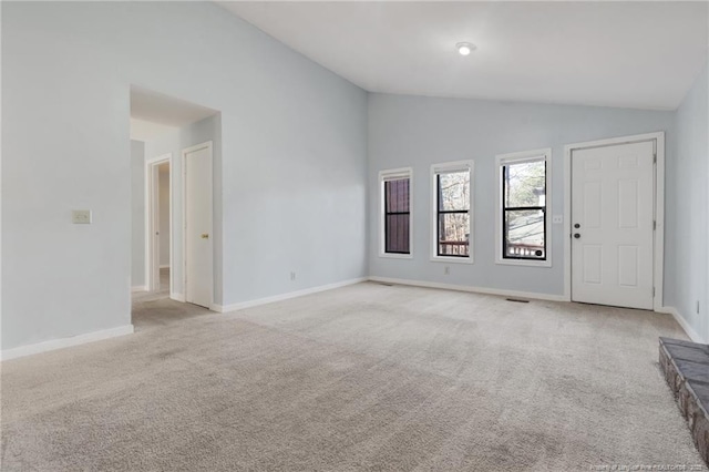 329 Whipple Tree Ln, Fayetteville, NC 28314 - unfurnished living room featuring lofted ceiling and light carpet