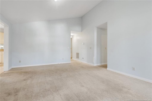 329 Whipple Tree Ln, Fayetteville, NC 28314 - unfurnished room featuring vaulted ceiling and light colored carpet