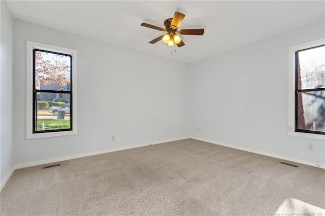 329 Whipple Tree Ln, Fayetteville, NC 28314 - carpeted empty room with plenty of natural light and ceiling fan