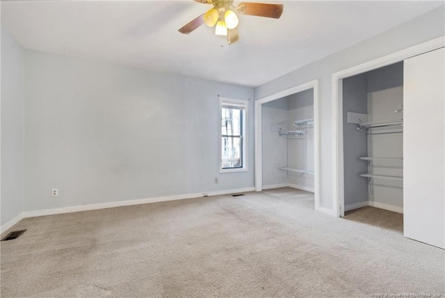329 Whipple Tree Ln, Fayetteville, NC 28314 - unfurnished bedroom featuring carpet floors, a ceiling fan, and two closets