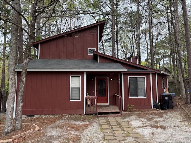 329 Whipple Tree Ln, Fayetteville, NC 28314 - mid-century modern home with a shingled roof and a chimney