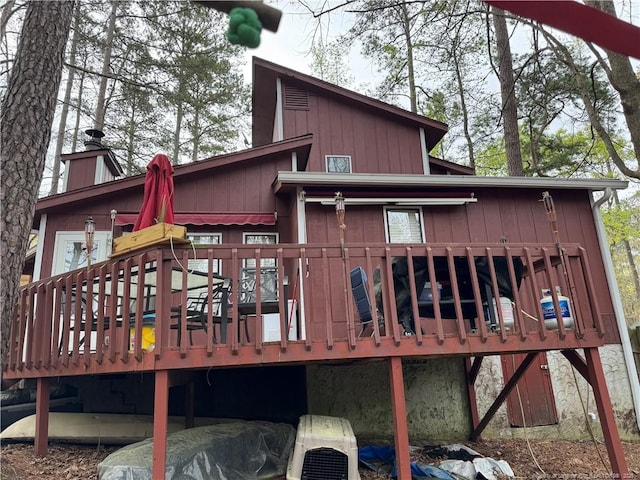 329 Whipple Tree Ln, Fayetteville, NC 28314 - rear view of house featuring a wooden deck and a chimney