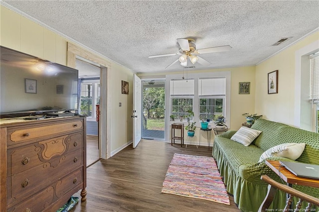 944 Cain Rd, Saint Pauls, NC 28384 - living area with ceiling fan, dark wood-style floors, crown molding, and a textured ceiling
