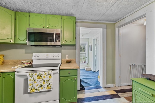 944 Cain Rd, Saint Pauls, NC 28384 - kitchen with stainless steel microwave, white range with electric cooktop, green cabinetry, and light countertops