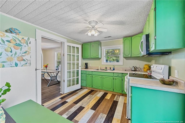 944 Cain Rd, Saint Pauls, NC 28384 - kitchen with white appliances, light countertops, light wood-type flooring, crown molding, and ceiling fan