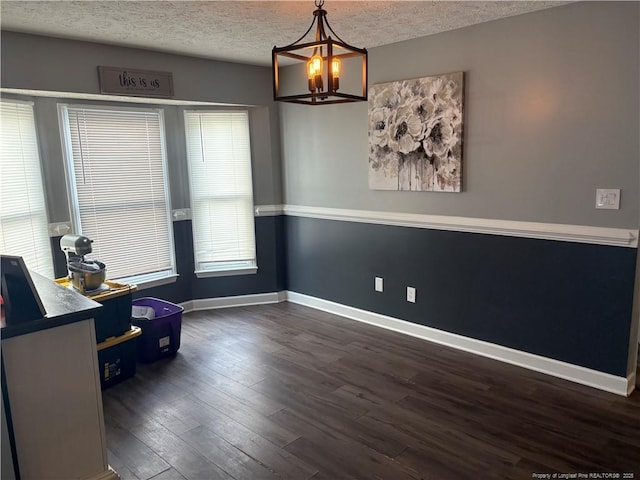 5931 Gist Pl, Fayetteville, NC 28306 - living area featuring a chandelier, a textured ceiling, and dark wood-type flooring
