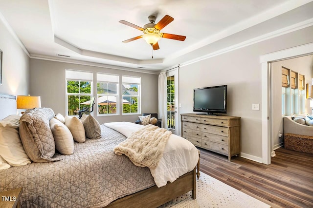 42 Juneberry Dr, Chapel Hill, NC 27516 - bedroom featuring a raised ceiling, wood finished floors, crown molding, access to outside, and ceiling fan