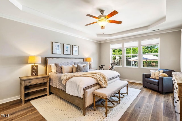 42 Juneberry Dr, Chapel Hill, NC 27516 - bedroom featuring a raised ceiling, dark wood-style flooring, ornamental molding, and ceiling fan