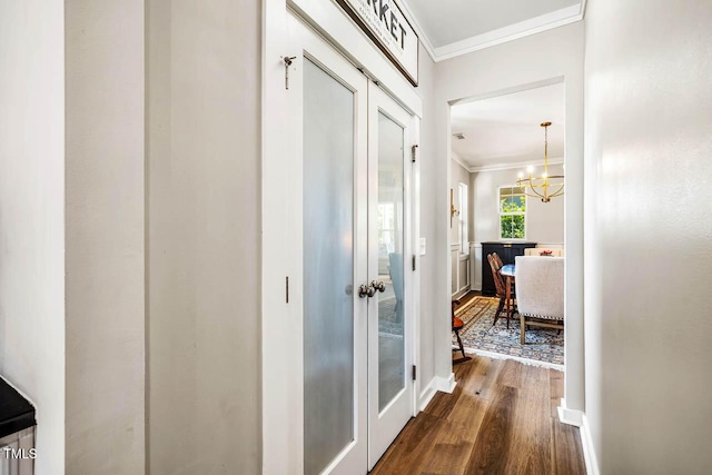 42 Juneberry Dr, Chapel Hill, NC 27516 - hall featuring crown molding, dark wood-style floors, and a chandelier