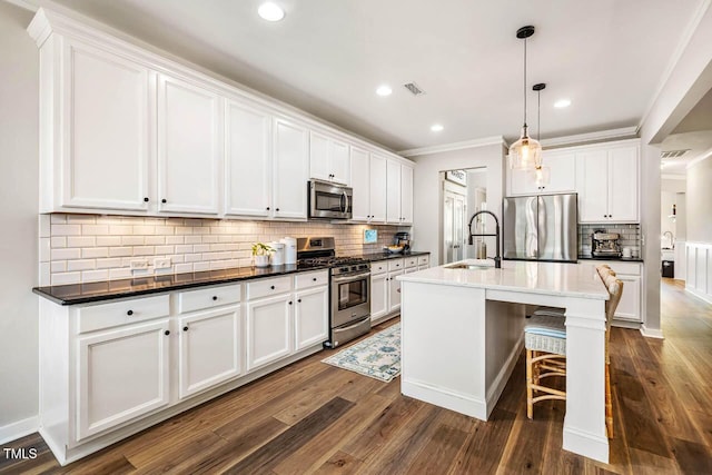 42 Juneberry Dr, Chapel Hill, NC 27516 - kitchen with appliances with stainless steel finishes, backsplash, dark wood-type flooring, white cabinets, and ornamental molding