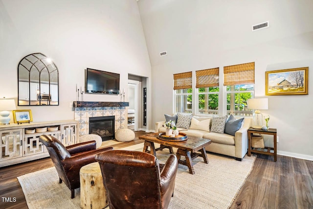42 Juneberry Dr, Chapel Hill, NC 27516 - living area featuring wood finished floors, a towering ceiling, and a fireplace