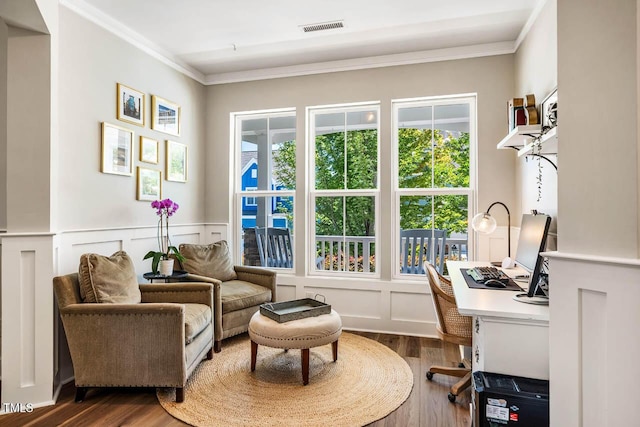 42 Juneberry Dr, Chapel Hill, NC 27516 - living area featuring crown molding, wood finished floors, an office area, healthy amount of natural light, and a decorative wall
