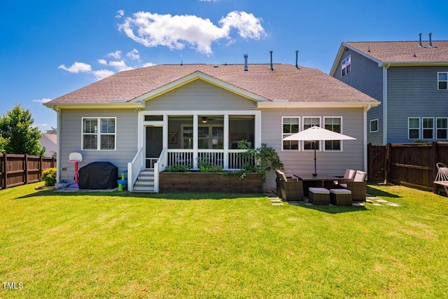 42 Juneberry Dr, Chapel Hill, NC 27516 - back of house featuring a fenced backyard, an outdoor living space, a sunroom, and roof with shingles